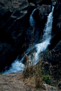 water falls on rocky mountain photo