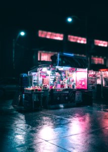 black and gray food stand during nighttime photo