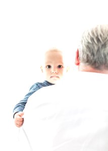 man carrying a baby