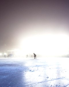 person standing on ice ground photo