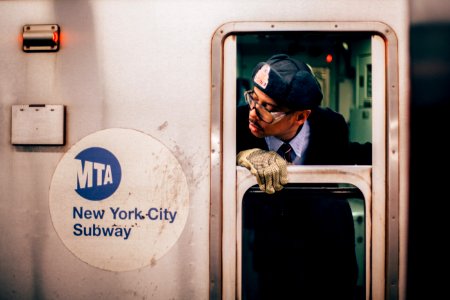 man peeking on new york city subway train window