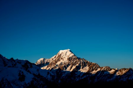 mountains with snow under blue sky photo