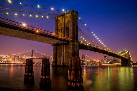 Brooklyn bridge with lights at night time photo
