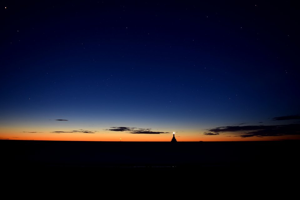 lighthouse on body of water