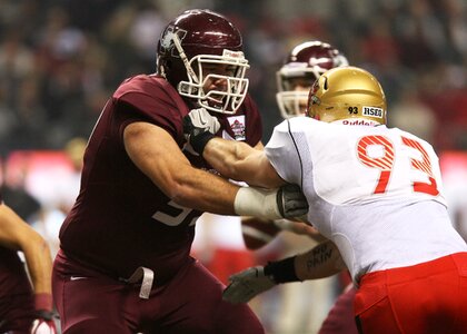 Competition offensive tackle blocking photo