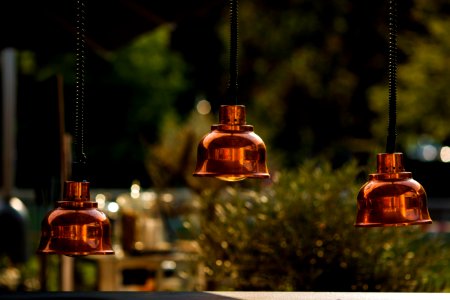 photo of brown 3-bulb pendant lamps