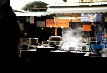 woman standing in front of kitchen with bowls