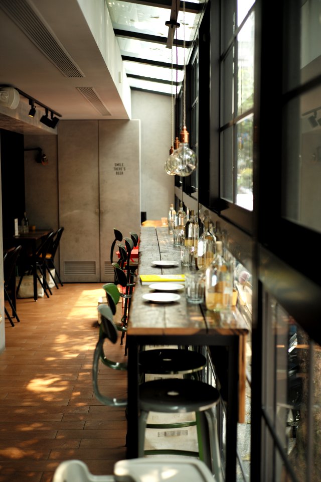 photograph of dining table arrangement with sphere pendant lamps