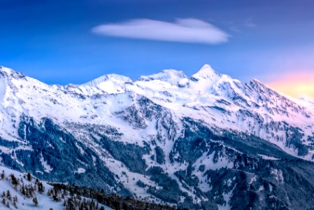 snow covered mountain under blue sky photo