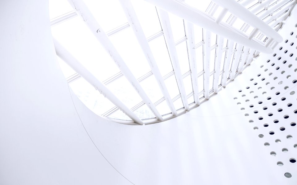 white spiral staircase with white railings