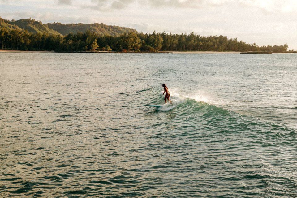 woman surfing during daytime photo