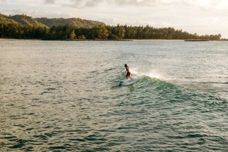woman surfing during daytime