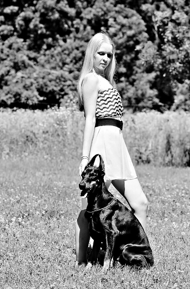 Woman with a dog doberman love