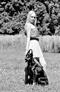 Woman with a dog doberman love photo