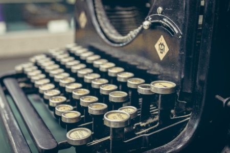 brown and gray typewriter photo