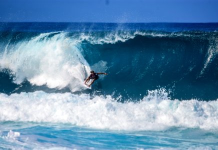 person surfing on wave photo