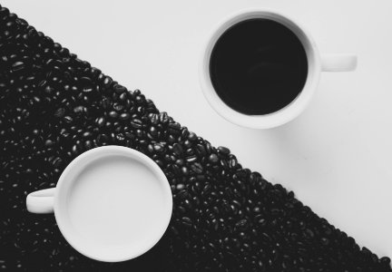white ceramic coffee mug filled with black liquid photo