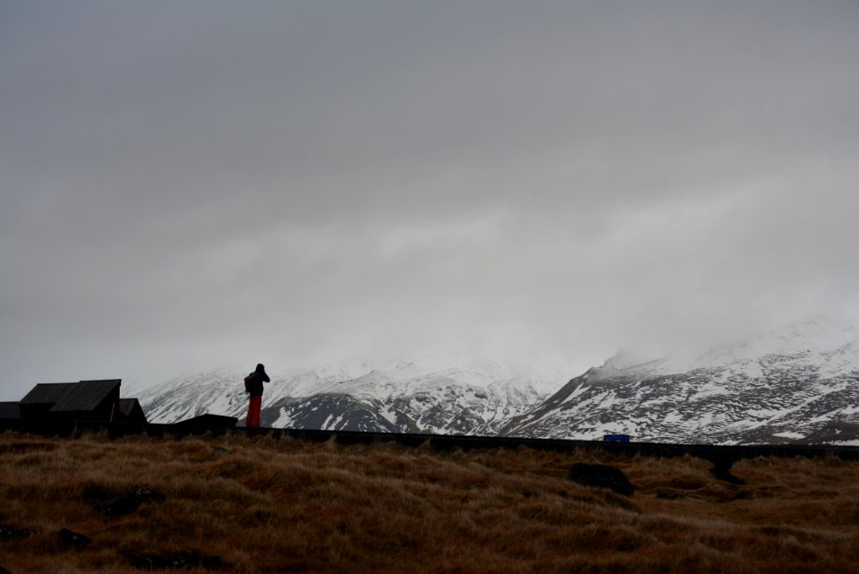 person standing front of mountain