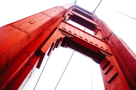 low angle photo of red suspension bridge photo
