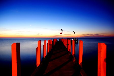 red dock under clear blue sky photo