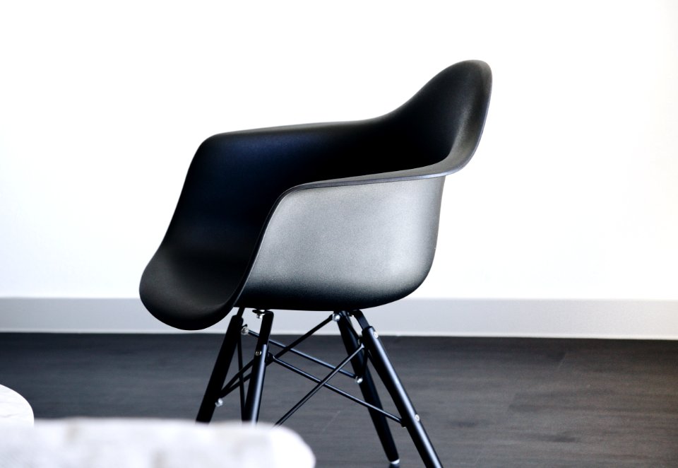 empty black plastic tub chair