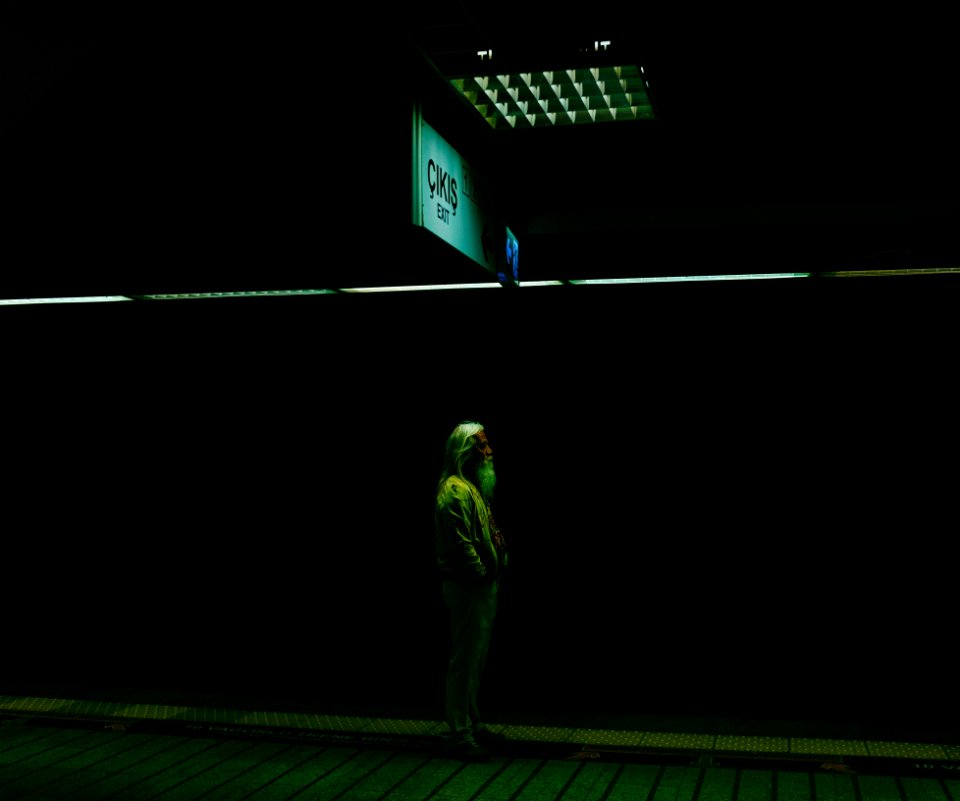 woman standing under ceiling light