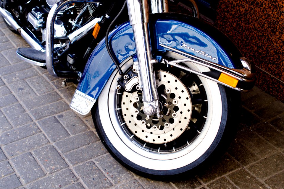 shallow focus photo of blue motorcycle fender