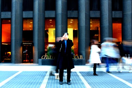 time-lapse photography on man holding phone photo