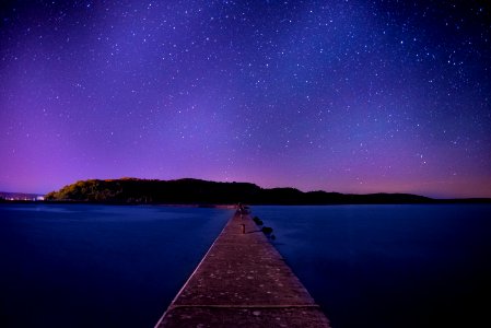 brown wooden dock under night sky photo