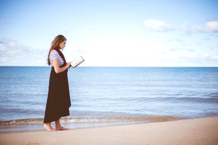 woman wearing black dress holding boo photo