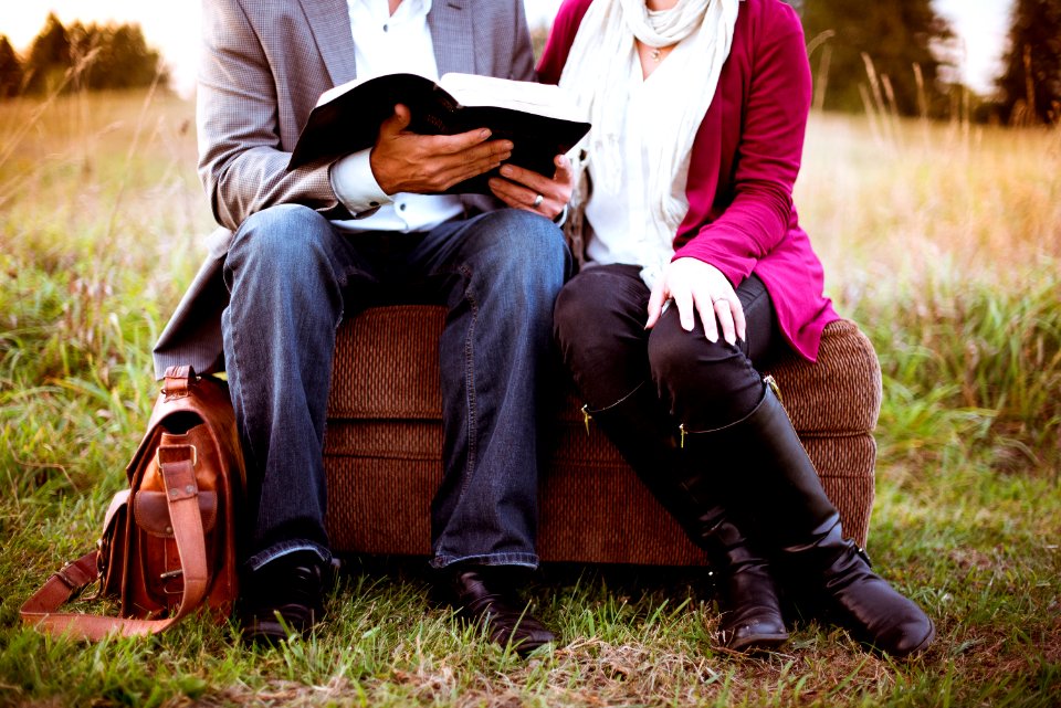 two people sitting beside each other