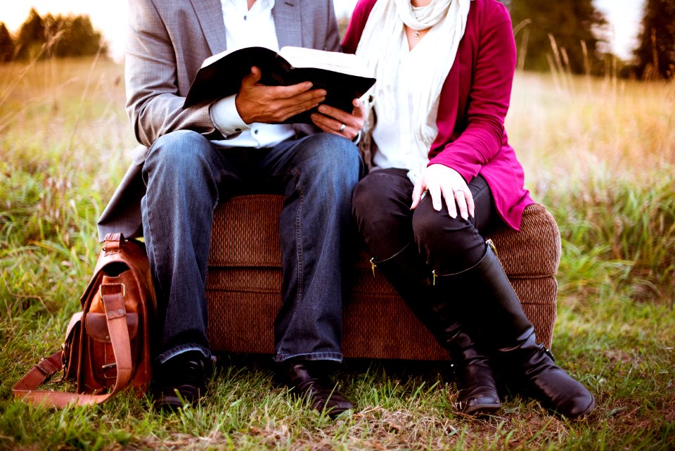 two people sitting beside each other photo