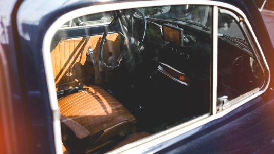 close photo of brown and black vehicle indoor