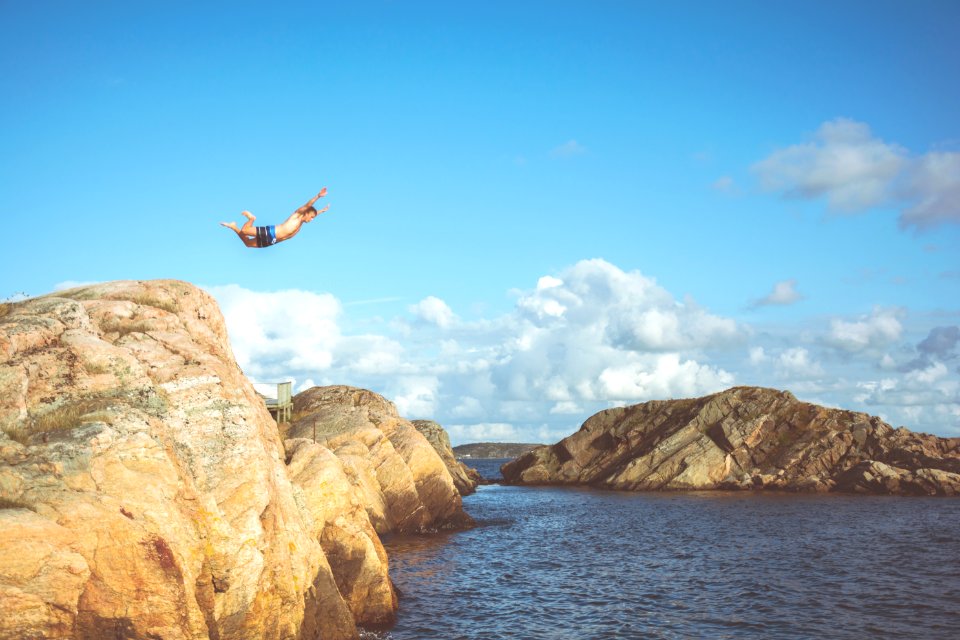 person diving in water