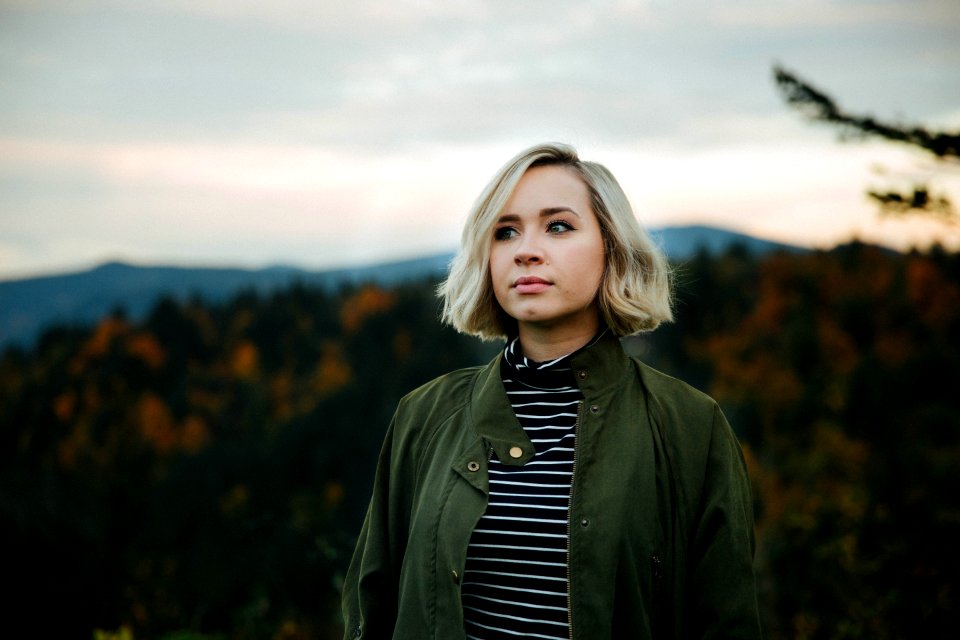 woman standing on top of mountain
