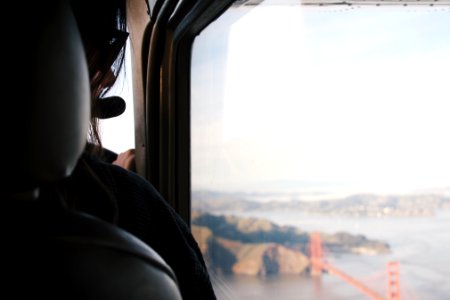 woman riding vehicle watching the golden gate bridge photo