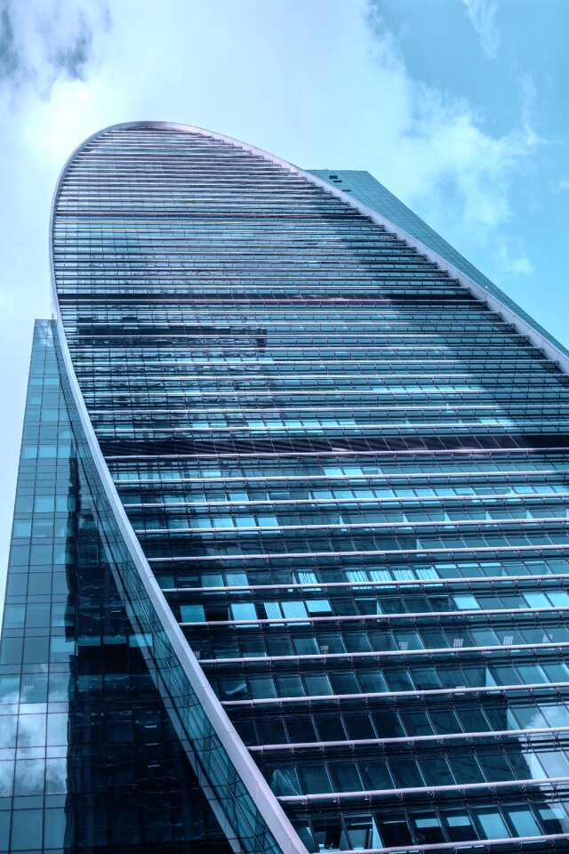 Blue multistory building dark blue sky