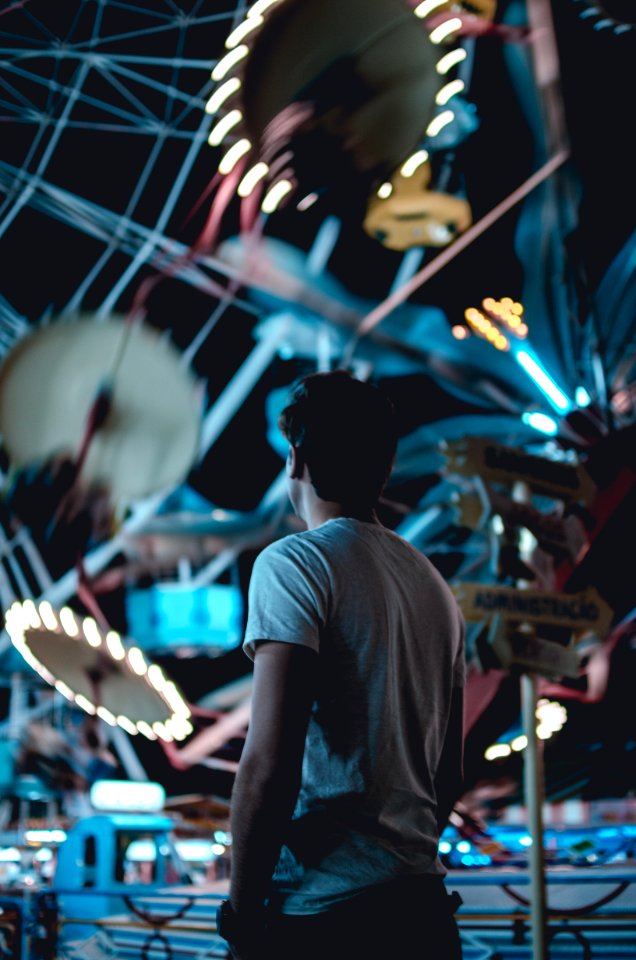 man standing near amusement park during daytime