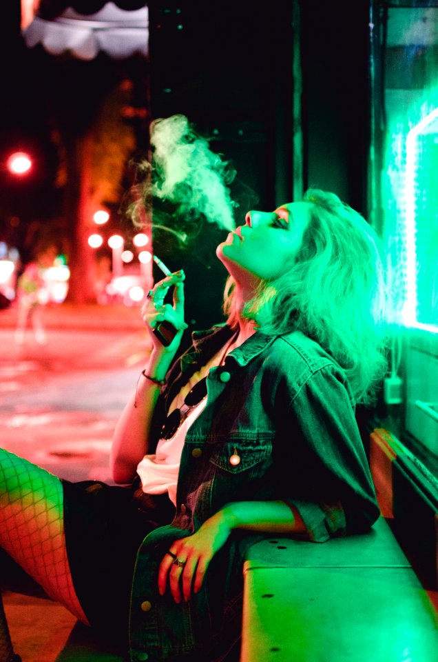 woman smoking during nighttime