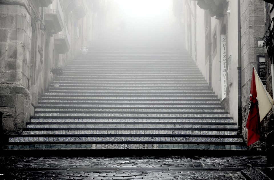 greyscale photography of concrete stairways