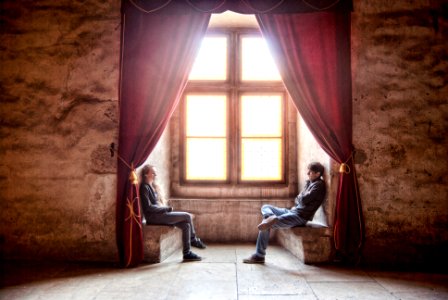 woman facing man in room