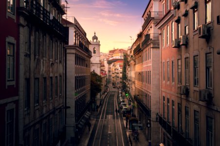 road in them middle of large buildings photo