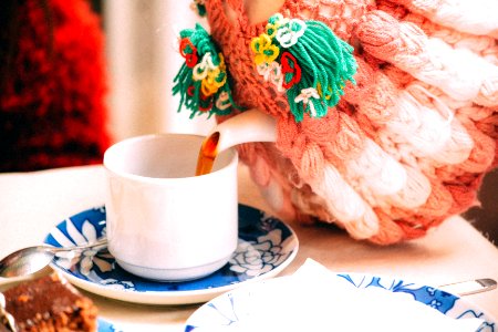 selective focus photography of person pouring teacup photo