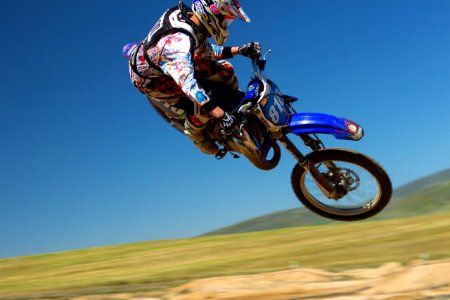 man doing motorcycle air stunt during daytime photo