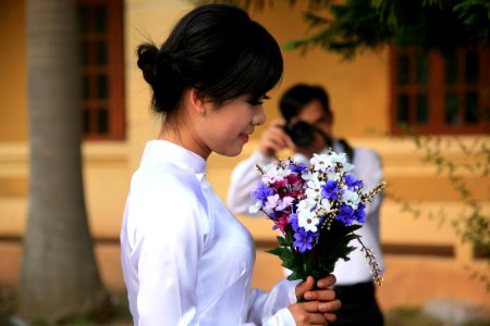 woman holding assorted-color flower bouquet photo