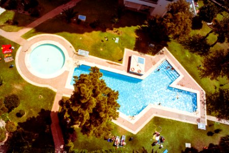 aerial shot of white and blue swimming pool photo