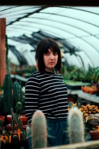 woman standing inside garden dome