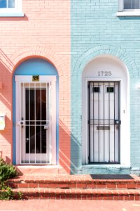 two white wooden doors with grills photo