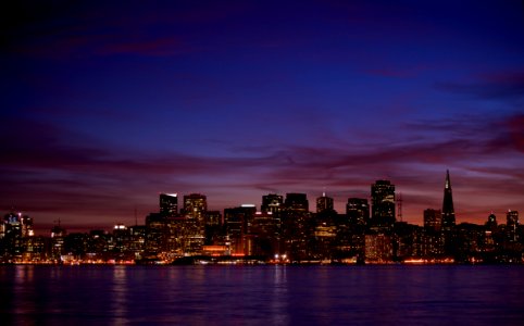 high rise buildings during night time photo