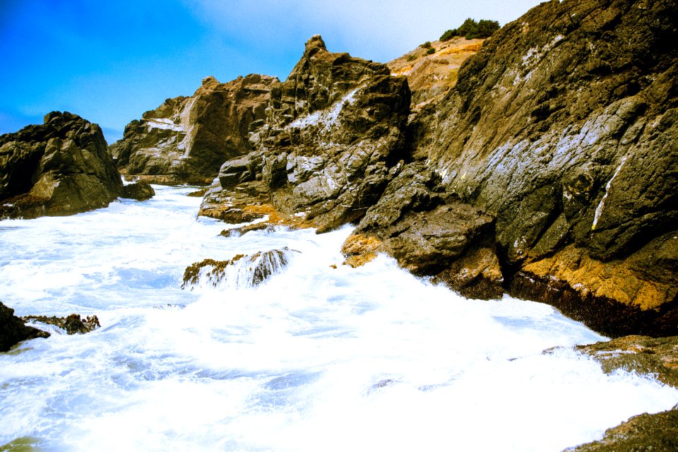 stone formation near body of water during daytime